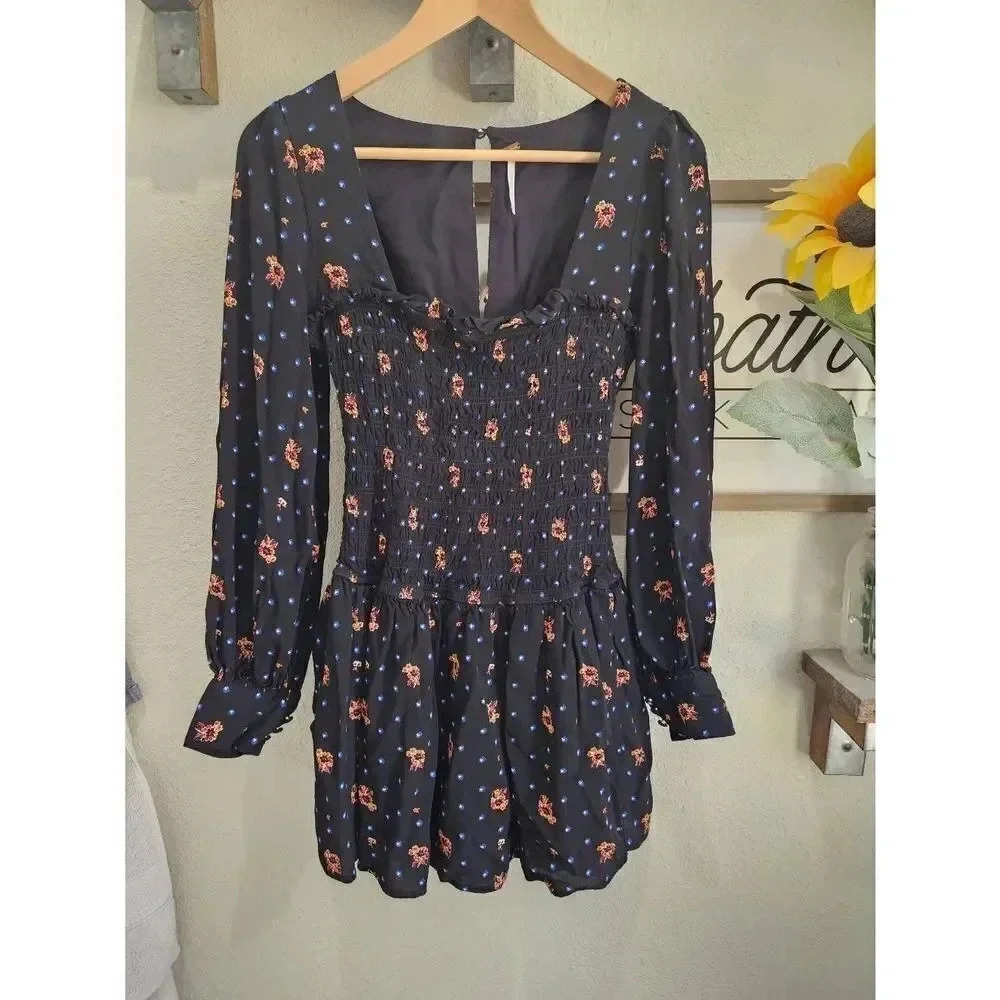 Free People Two Faces Smocked Bodice Floral Mini Dress Long Sleeved Size XS.